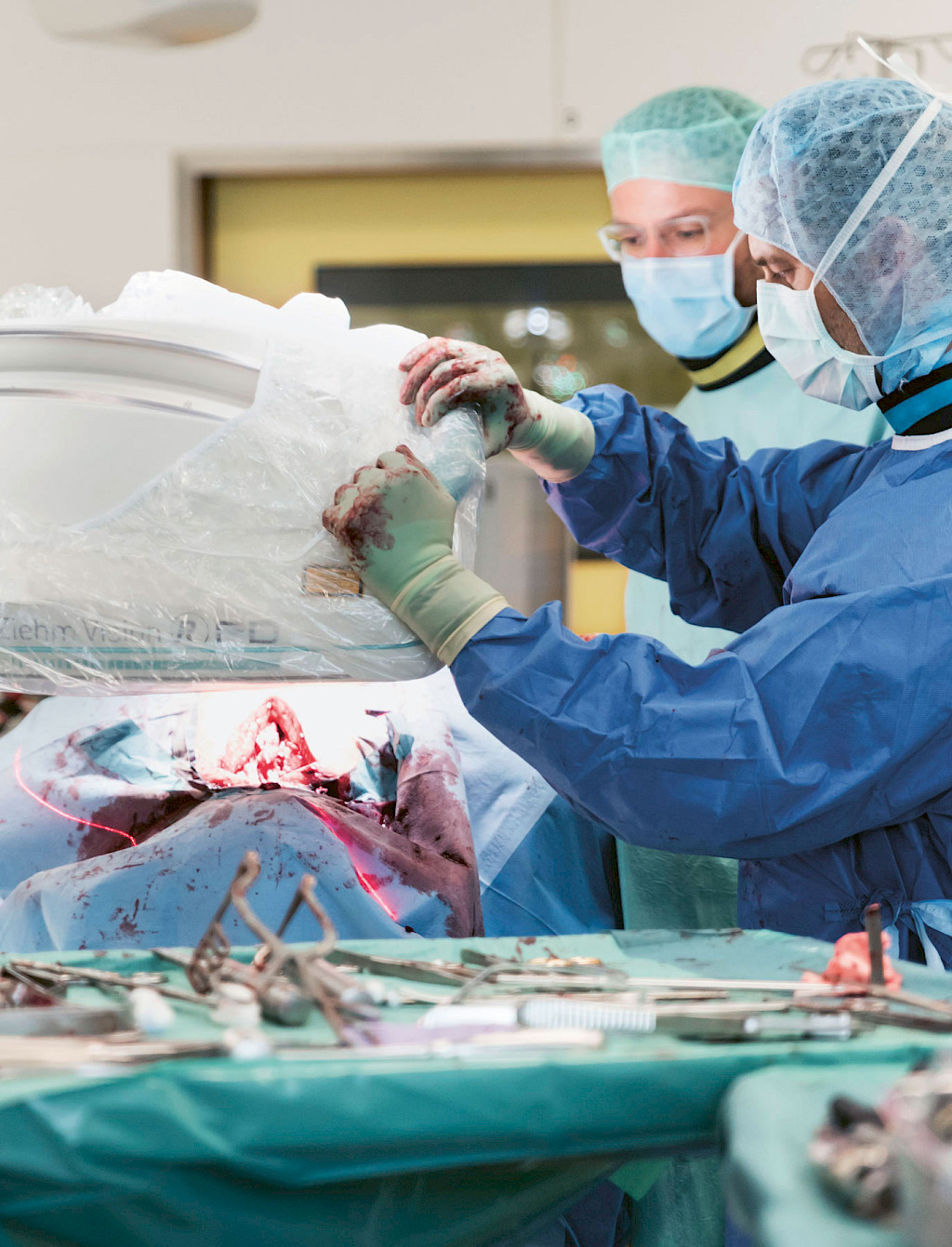 Surgeon positions C-arm for a final control image