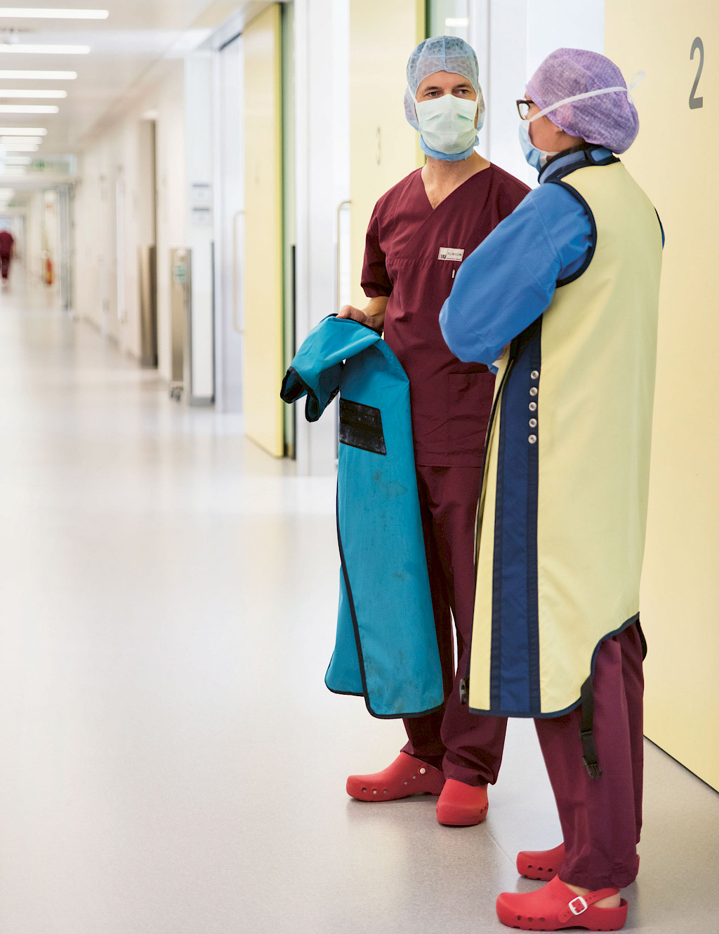 Nadja Baitis and Dr. Zeckey talking in front of an operating room