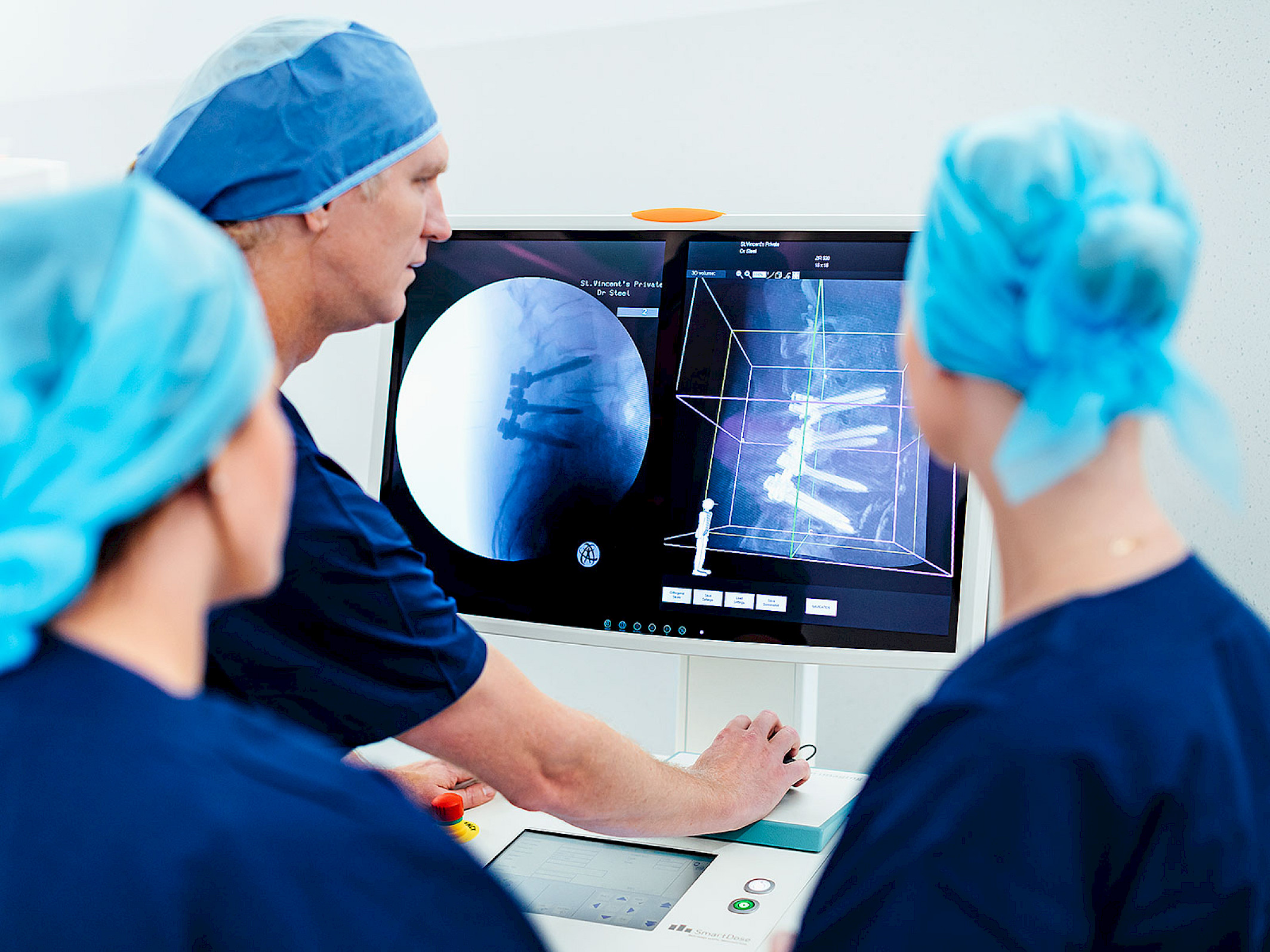 Dr. Steel is checking a clinical image of a 3D spine surgery scan.