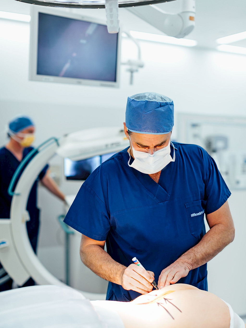 Timothy Steel marks the operation area before surgery.